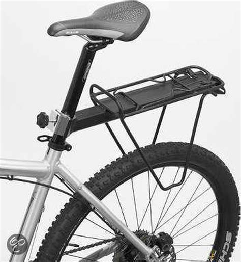 Illustratie die de verschillende bevestigingsmethoden van fietskar koppelingen toont: aan de as, zadelpen en bagagedrager.