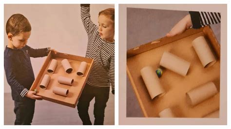 Kinderen spelen met een zelfgemaakte trein van kartonnen dozen