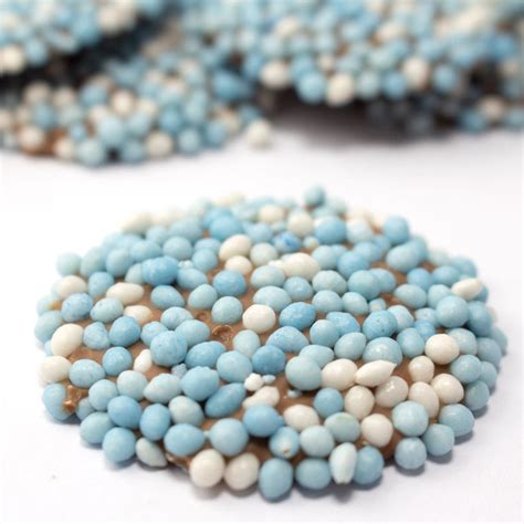 Verpakking met Geboorte Flikken Blauw, met nadruk op de ronde vorm en blauwe spikkels