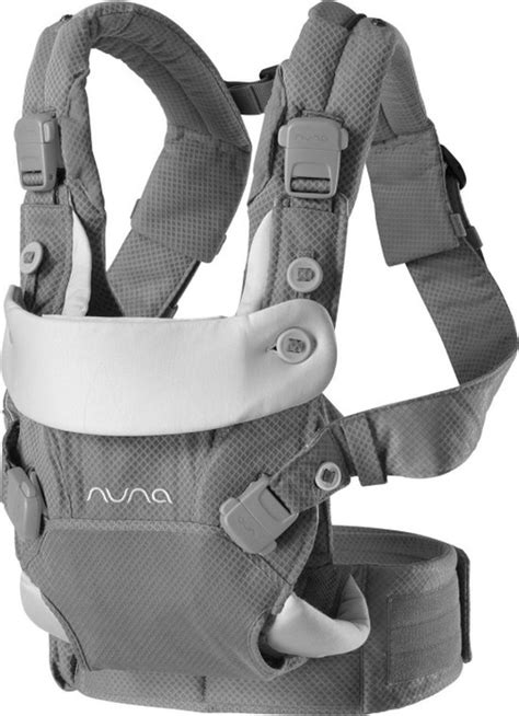 Overzicht van de praktische extra's van de Nuna Cudl draagzak, zoals het opbergvak en de zonnekap.