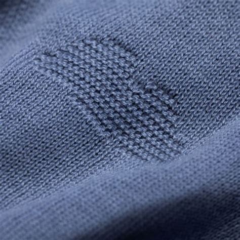 Detail van de gebreide textuur van de Joolz Cloud Soft Deken